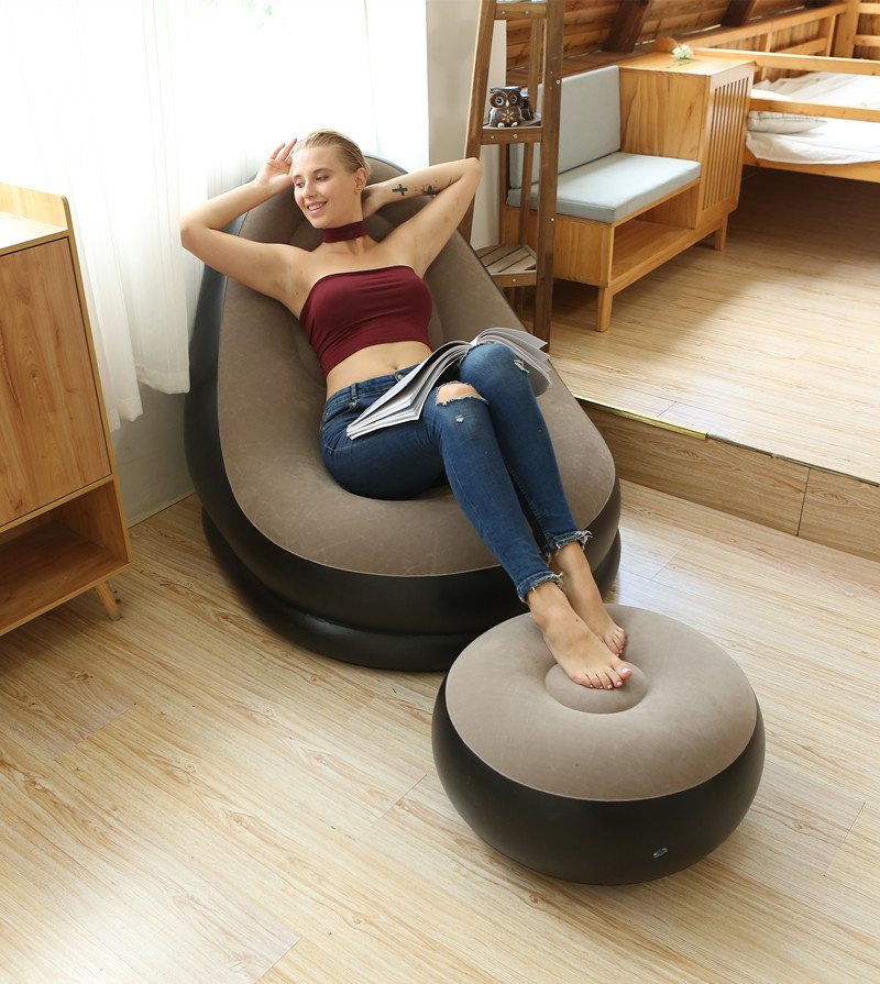 Woman relaxing on the Inflatable Air Sofa with ottoman